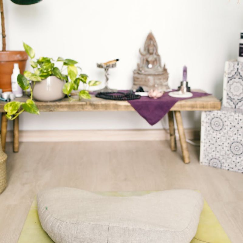 A calm, minimalist space with a yoga mat and soft natural light.