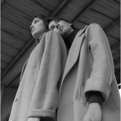 A gentle stretching pose viewed from a low angle.