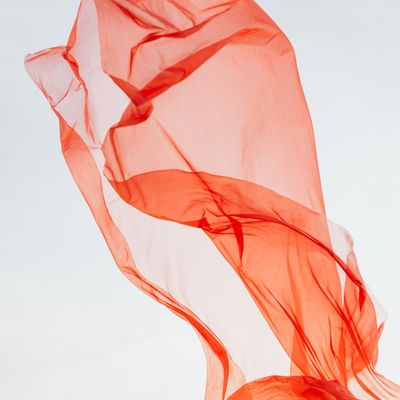 Abstract shot of fabric flowing, symbolizing breath.